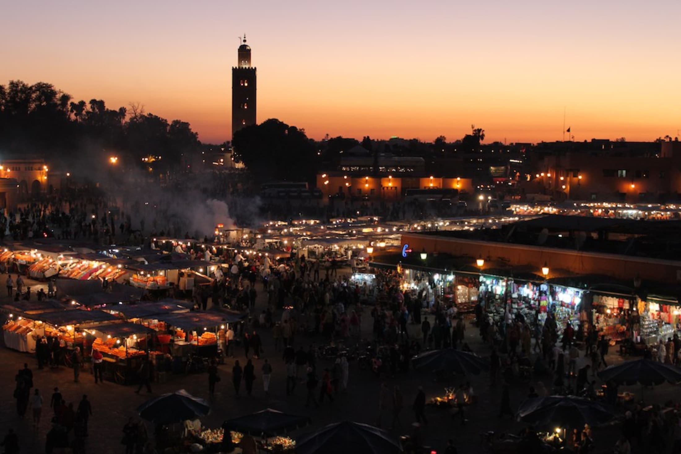 Jemaa el-Fnaa as the sun sets, food stalls setting up